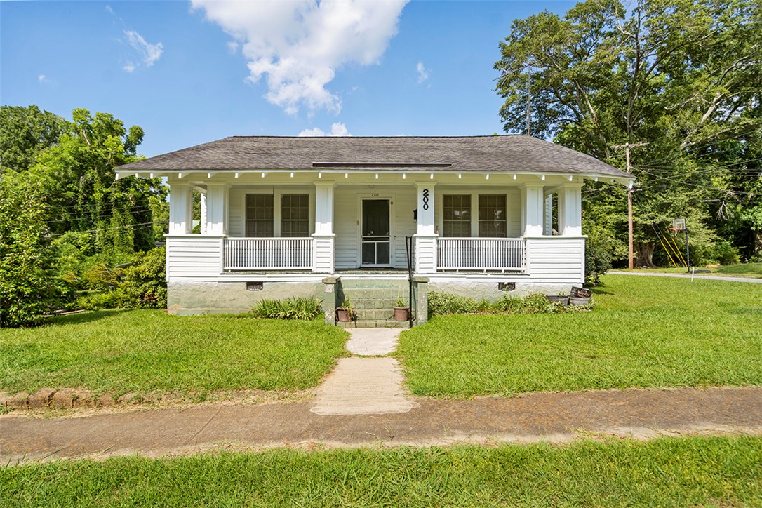 200 Louisiana Street Honea Path, SC 29654 - Photo 1 of 13 A charming bungalow with a covered front porch, set back from the street on a generous lot.