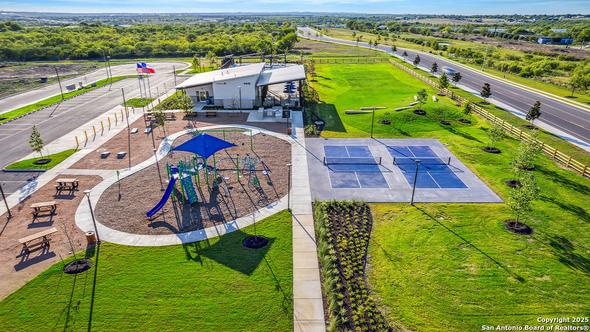 12603 Desert Fox Converse, TX 78109 - Photo 43 of 50 aerial view of a swimming pool with a yard and seating area