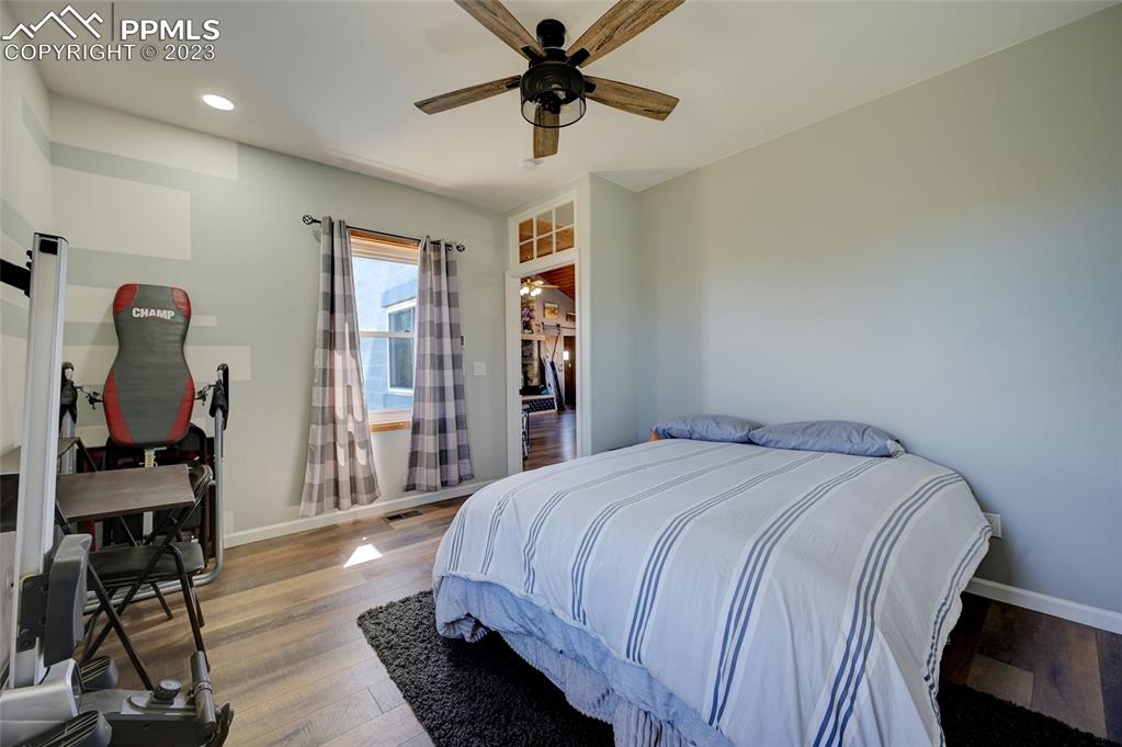 13880 Eastonville Road Elbert, CO 80106 - Photo 22 of 44 a bedroom with a bed a desk and chair