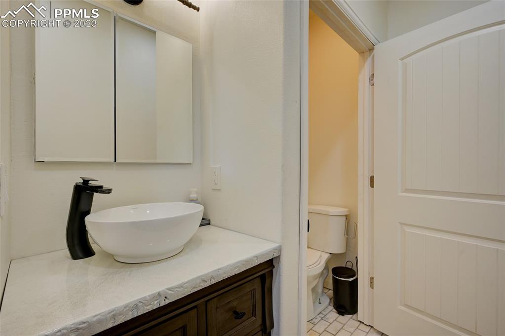 13880 Eastonville Road Elbert, CO 80106 - Photo 25 of 44 a bathroom with a sink and a mirror