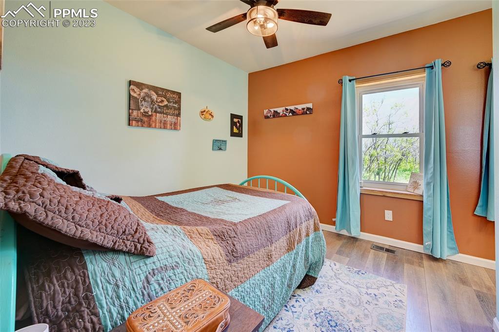 13880 Eastonville Road Elbert, CO 80106 - Photo 28 of 44 a bedroom with bed and a window