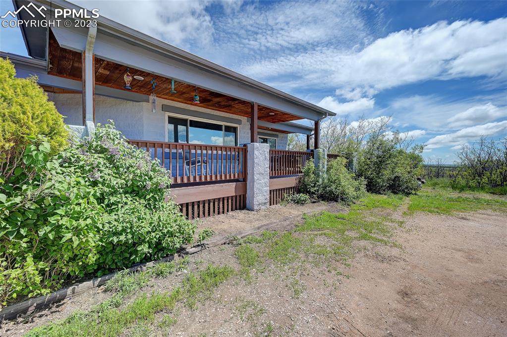 13880 Eastonville Road Elbert, CO 80106 - Photo 3 of 44 a front view of a house with garden