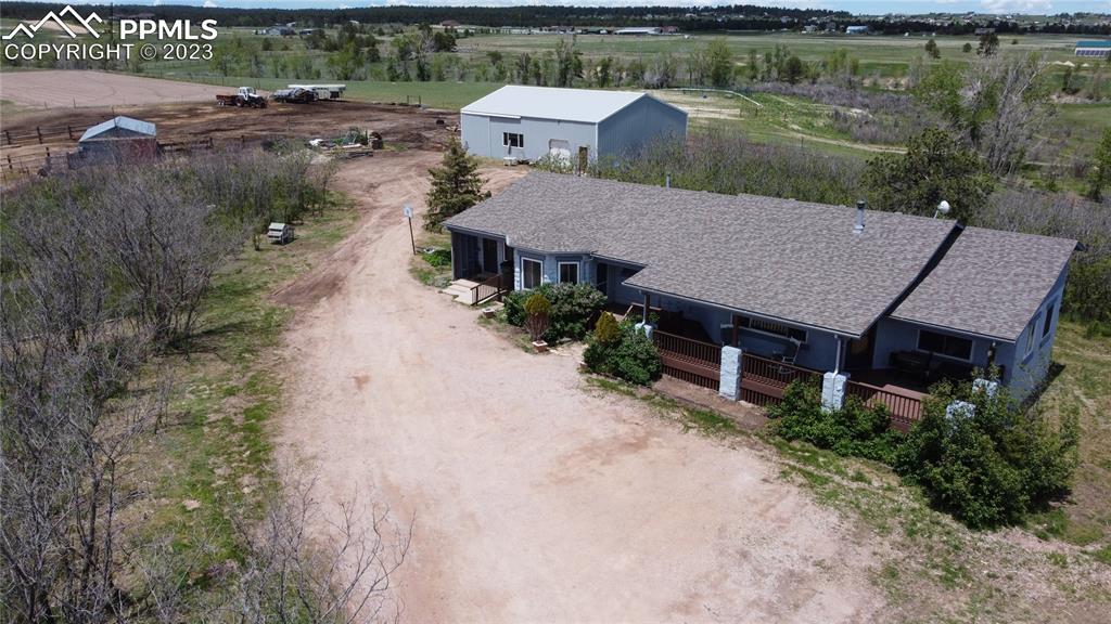 13880 Eastonville Road Elbert, CO 80106 - Photo 32 of 44 an aerial view of a house with a yard and lake view