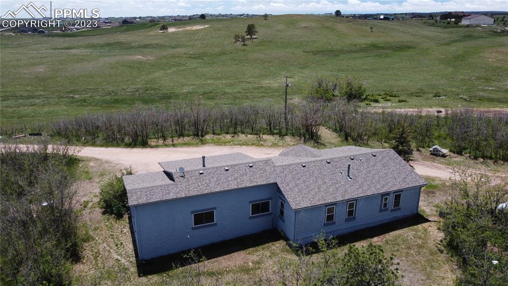 13880 Eastonville Road Elbert, CO 80106 - Photo 33 of 44 a view of a house with a yard and lake view