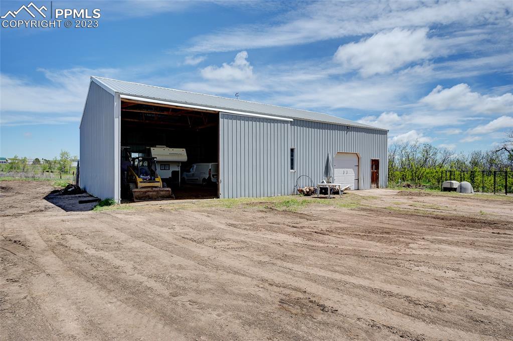 13880 Eastonville Road Elbert, CO 80106 - Photo 35 of 44 a view of a livingroom with wooden floor and a parking space