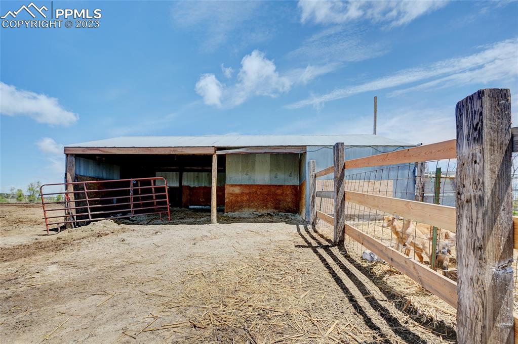 13880 Eastonville Road Elbert, CO 80106 - Photo 39 of 44 a view of a house with a yard and garage