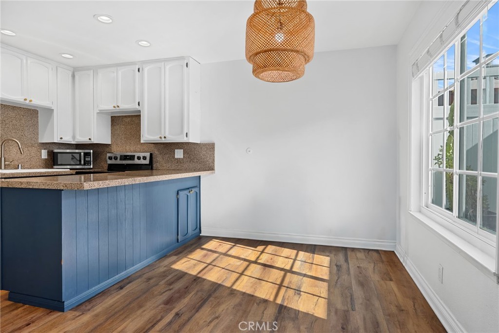 1845 Anaheim Avenue Costa Mesa, CA 92627 - Photo 4 of 13 a kitchen with a sink and a stove