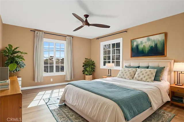 a bedroom with a large bed and a window