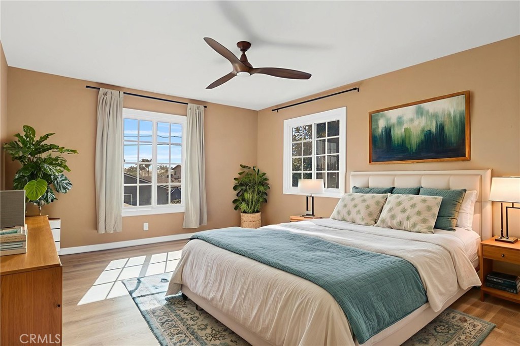 1845 Anaheim Avenue Costa Mesa, CA 92627 - Photo 7 of 13 a bedroom with a large bed and a window