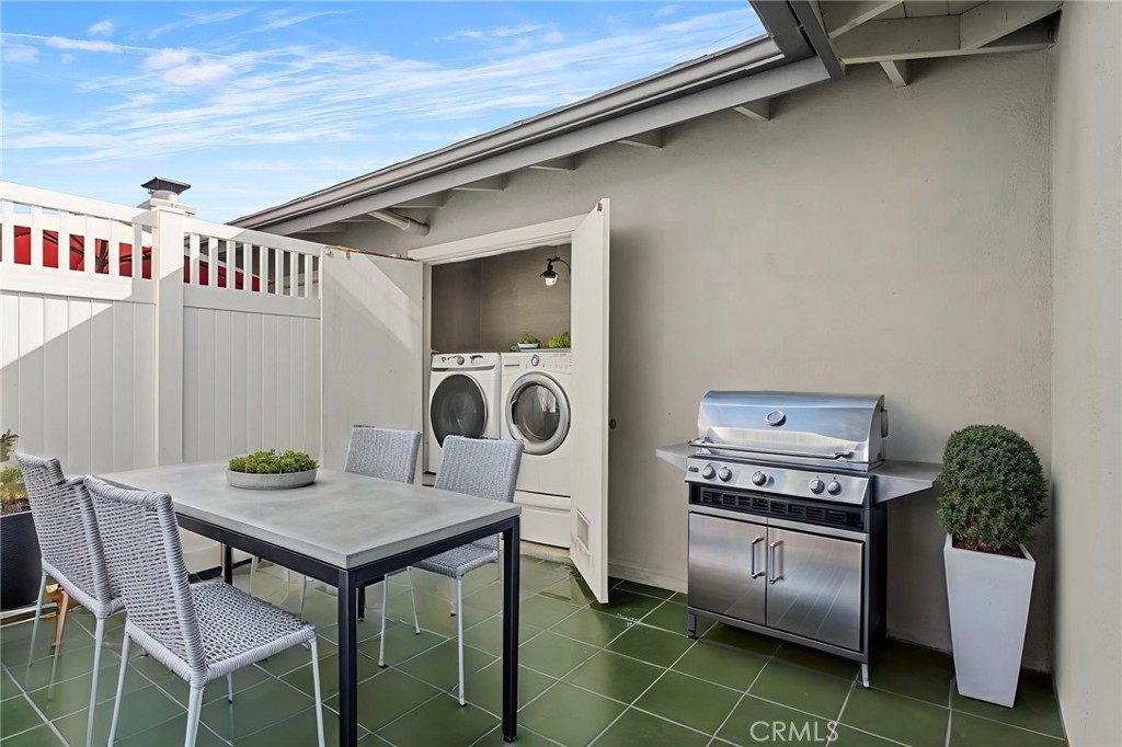 1845 Anaheim Avenue Costa Mesa, CA 92627 - Photo 10 of 13 a view of a kitchen area with furniture and wooden floor