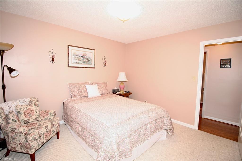 7114 Harper Ridge Court Oak Ridge, NC 27310 - Photo 13 of 28 2nd bedroom across from hall bathroom.