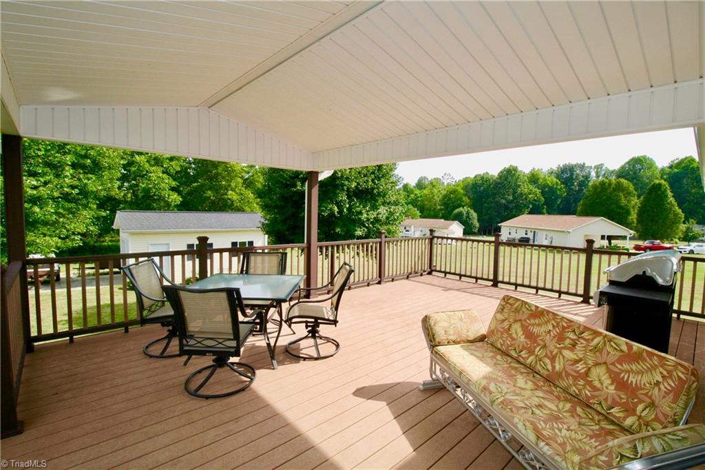 7114 Harper Ridge Court Oak Ridge, NC 27310 - Photo 16 of 28 Beautiful composite 16x24 deck perfect for entertaining year round!