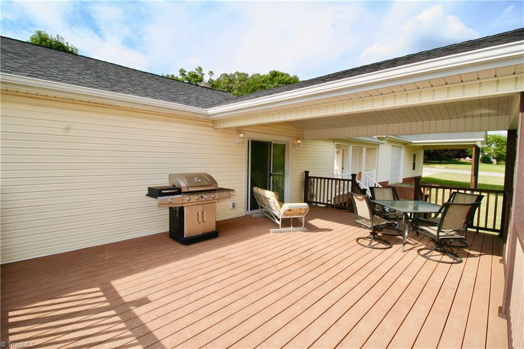 7114 Harper Ridge Court Oak Ridge, NC 27310 - Photo 18 of 28 You get the best of both with this outdoor space!