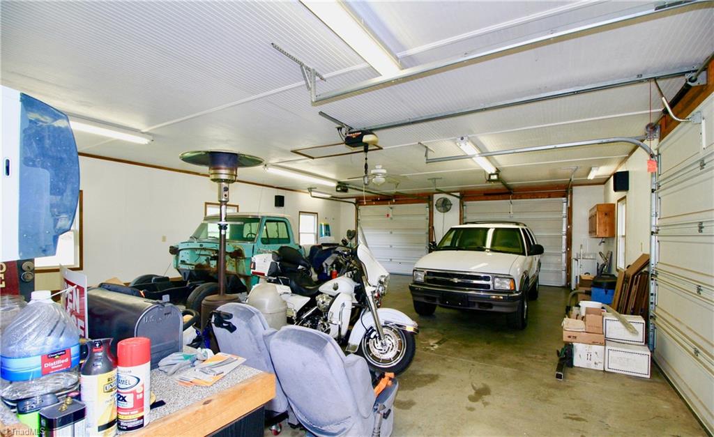 7114 Harper Ridge Court Oak Ridge, NC 27310 - Photo 20 of 28 3 car detached garage with 2 loading bays in the front and 1 on the side.