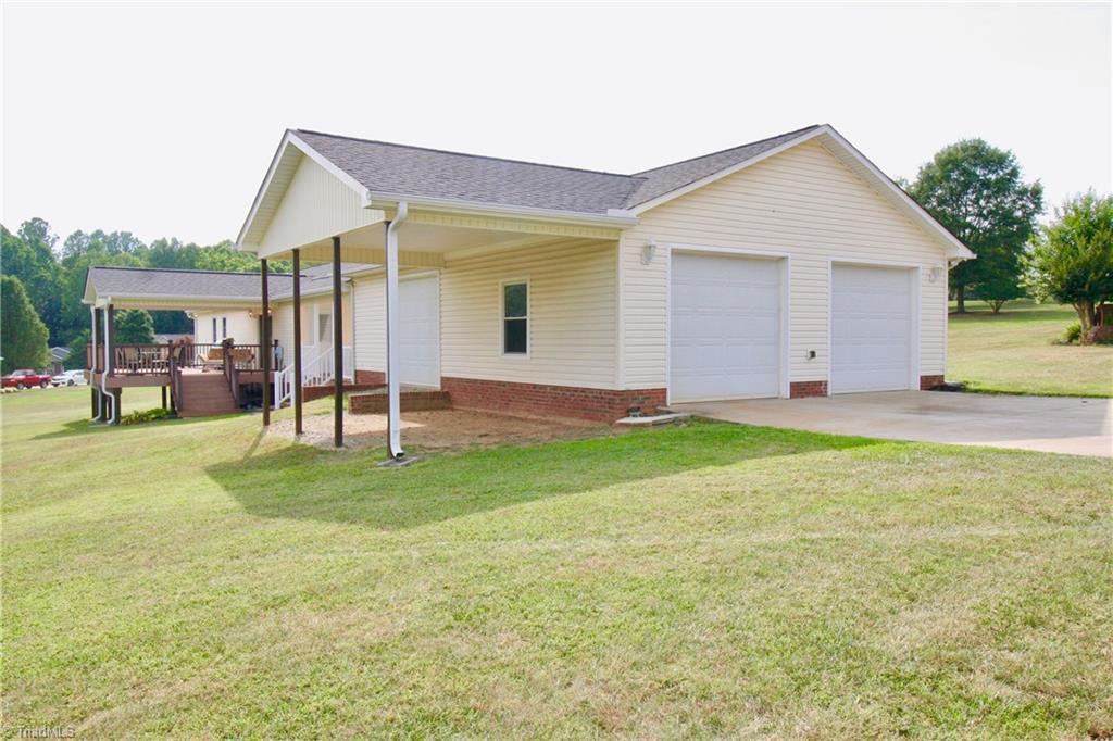 3 car detached garage with side loading garage access.