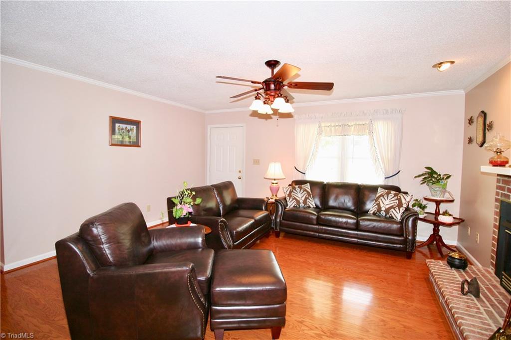 Spacious living room with gas logs.