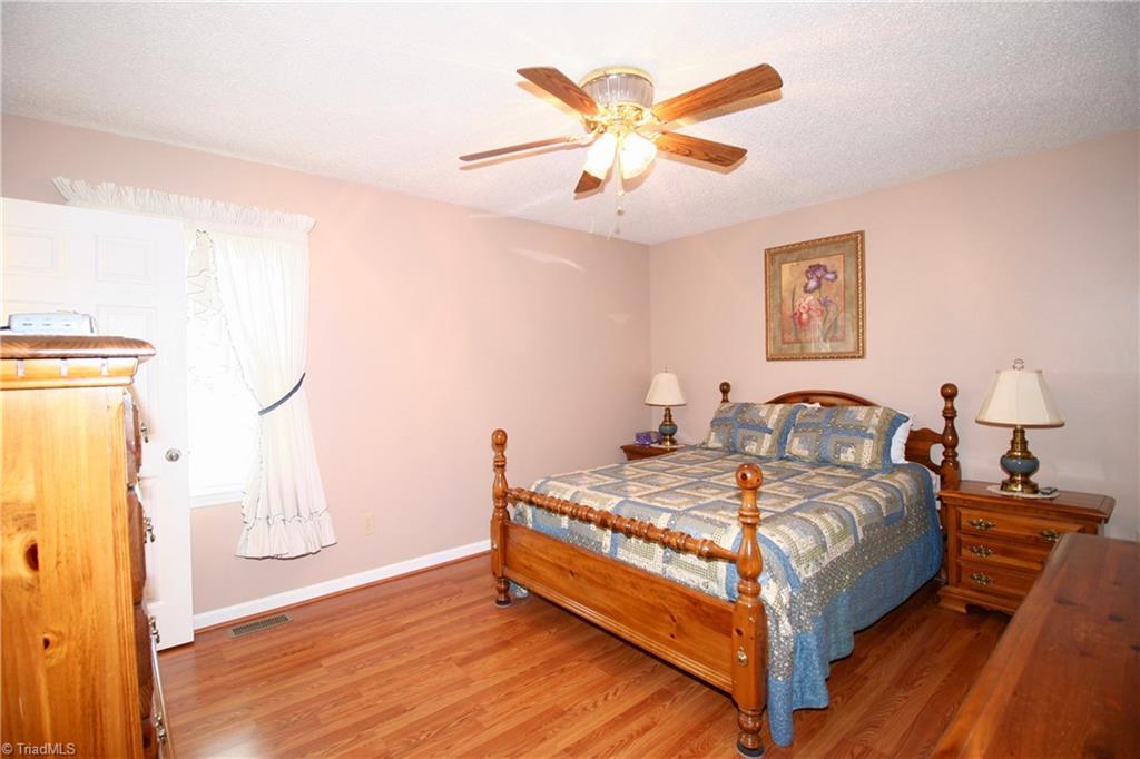 7114 Harper Ridge Court Oak Ridge, NC 27310 - Photo 10 of 28 Newer laminate flooring in Master bedroom.