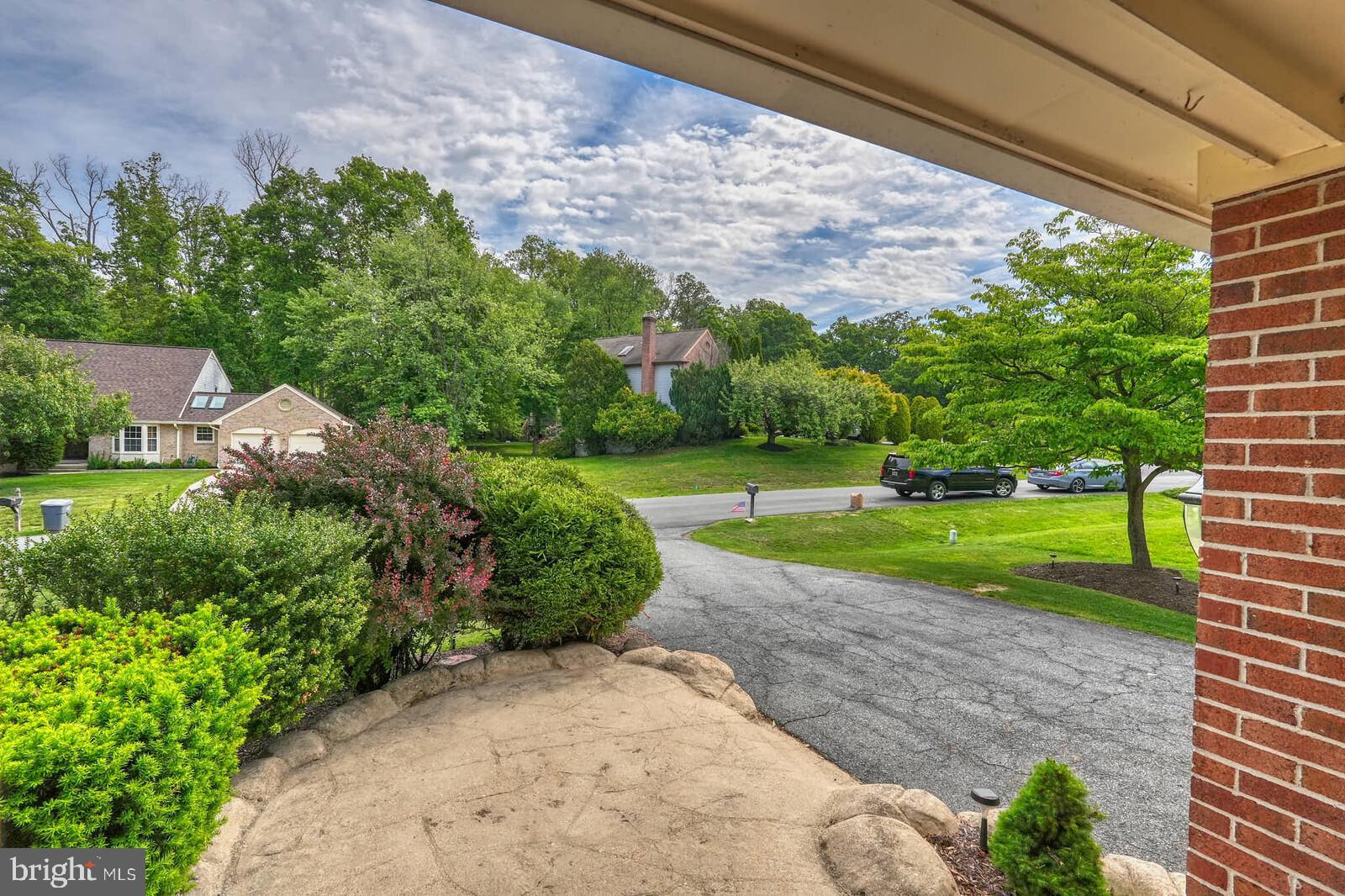 2108 Merrifields Drive Silver Spring, MD 20906 - Photo 65 of 69 a view of a garden with a building in the background
