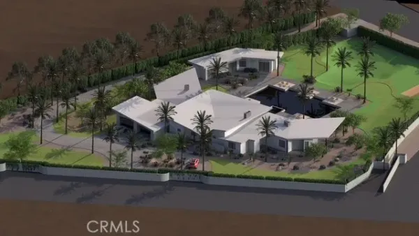 an aerial view of a house with garden space and street view
