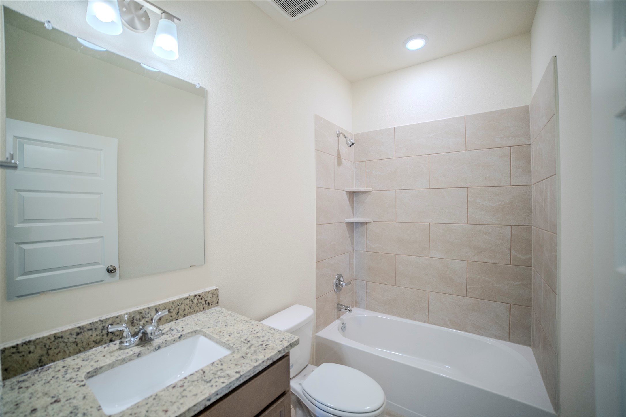 1402 Lk Rdg Drive Brenham, TX 77833 - Photo 9 of 35 a bathroom with a granite countertop sink toilet and shower
