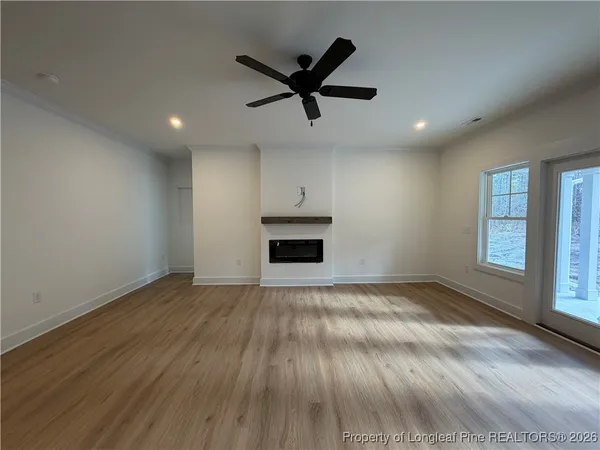 a kitchen with granite countertop a sink and a stove top oven