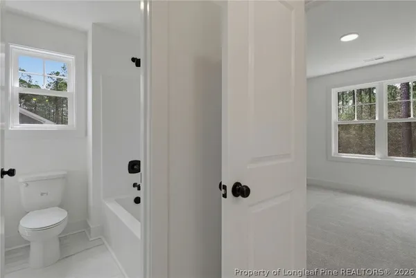 a picture of a living room and with a white house