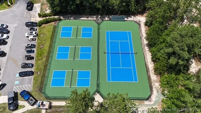 a backyard of a house with garden barbeque oven and outdoor seating