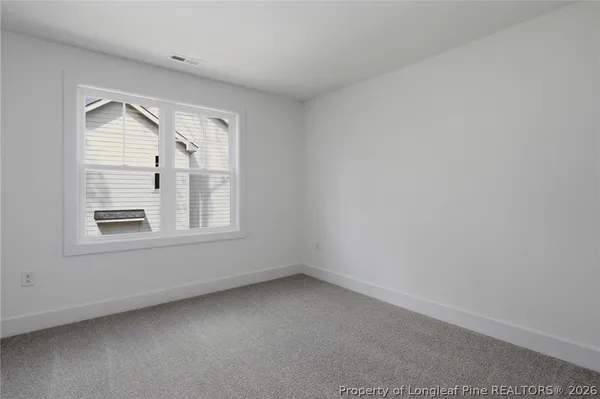 a view of a wooden deck and lake