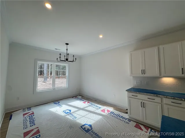 a bedroom with bed and window