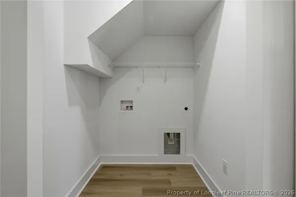 a large kitchen with stainless steel appliances kitchen island granite countertop a stove a sink and a refrigerator