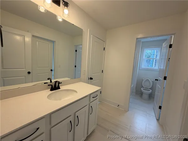 a bathroom with a shower and a glass door