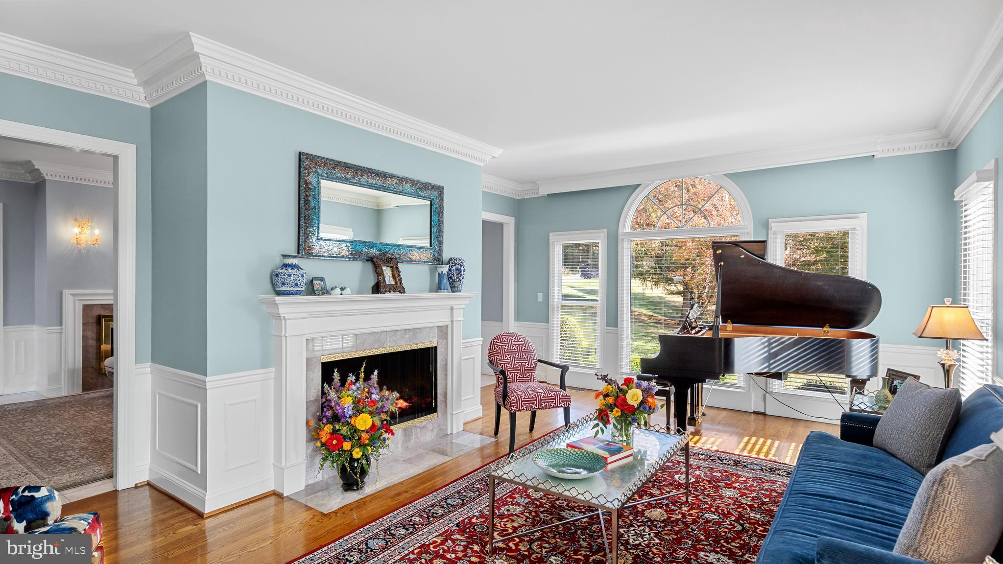 927 Western Road Hunt Valley, MD 21030 - Photo 13 of 80 a living room with furniture a fireplace and a flat screen tv