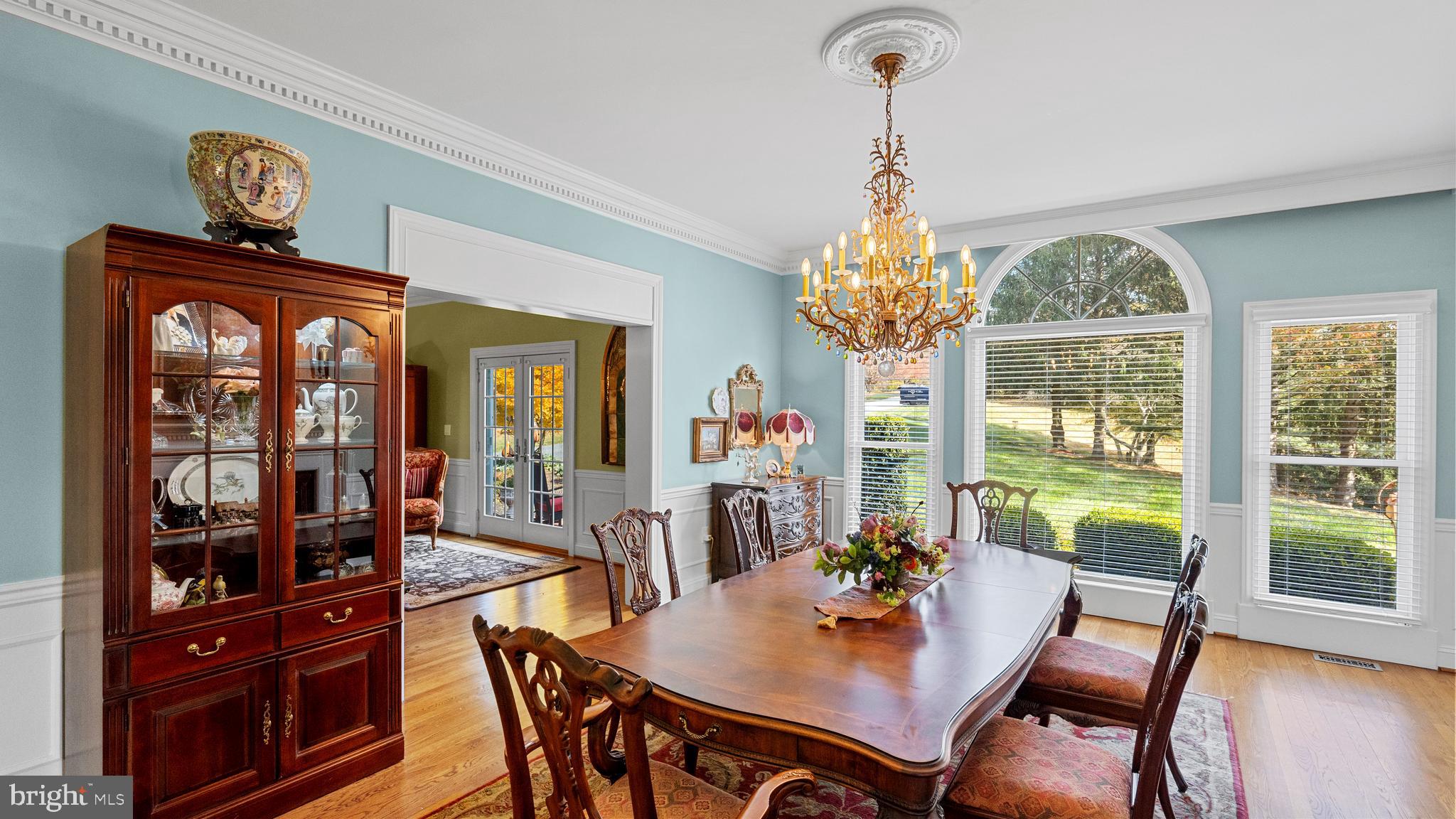 927 Western Road Hunt Valley, MD 21030 - Photo 33 of 80 a dining room with furniture a chandelier and wooden floor