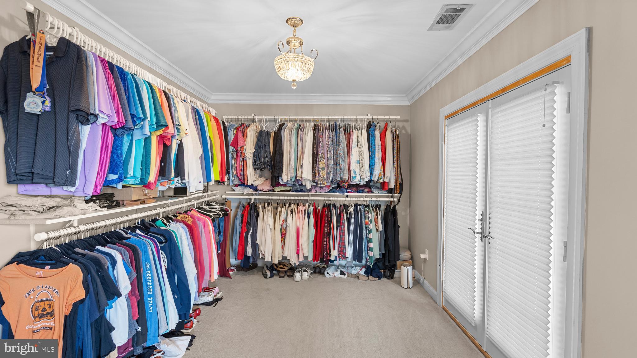 927 Western Road Hunt Valley, MD 21030 - Photo 40 of 80 a view of walk in closet with clothes