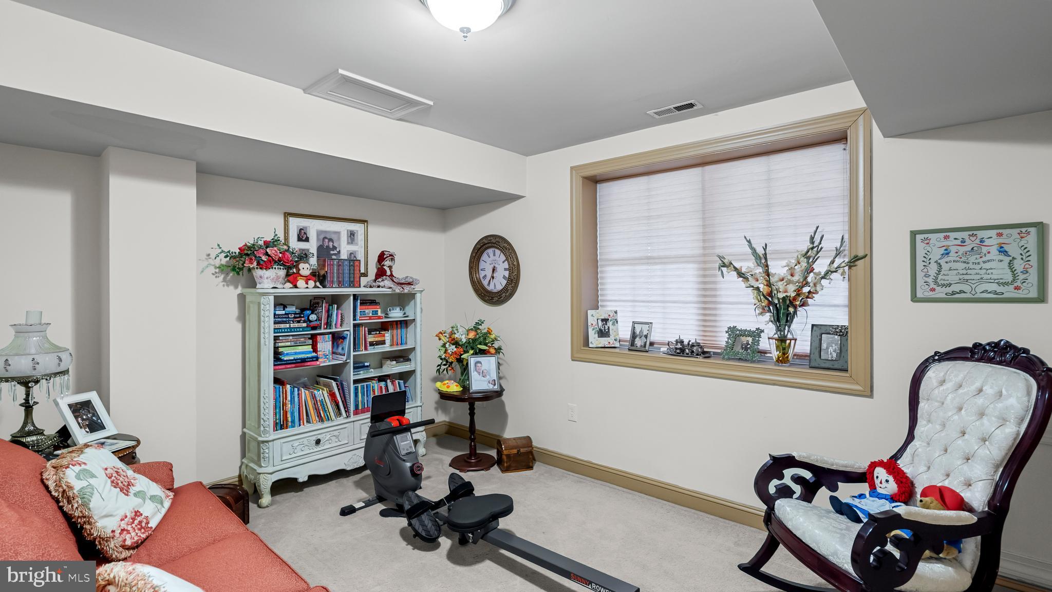 927 Western Road Hunt Valley, MD 21030 - Photo 58 of 80 a living room with lots of furniture and a wooden floor