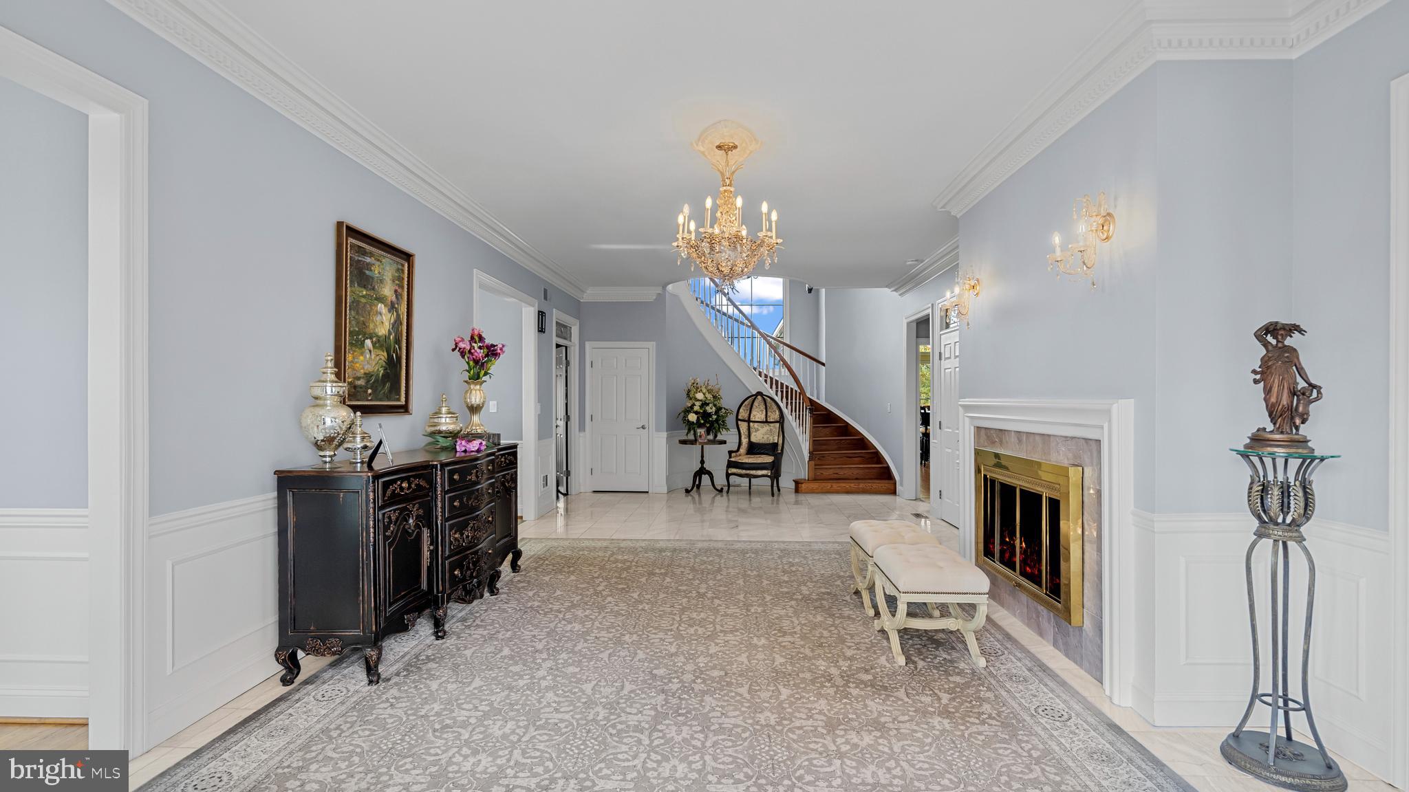 927 Western Road Hunt Valley, MD 21030 - Photo 10 of 80 a living room with furniture and a chandelier