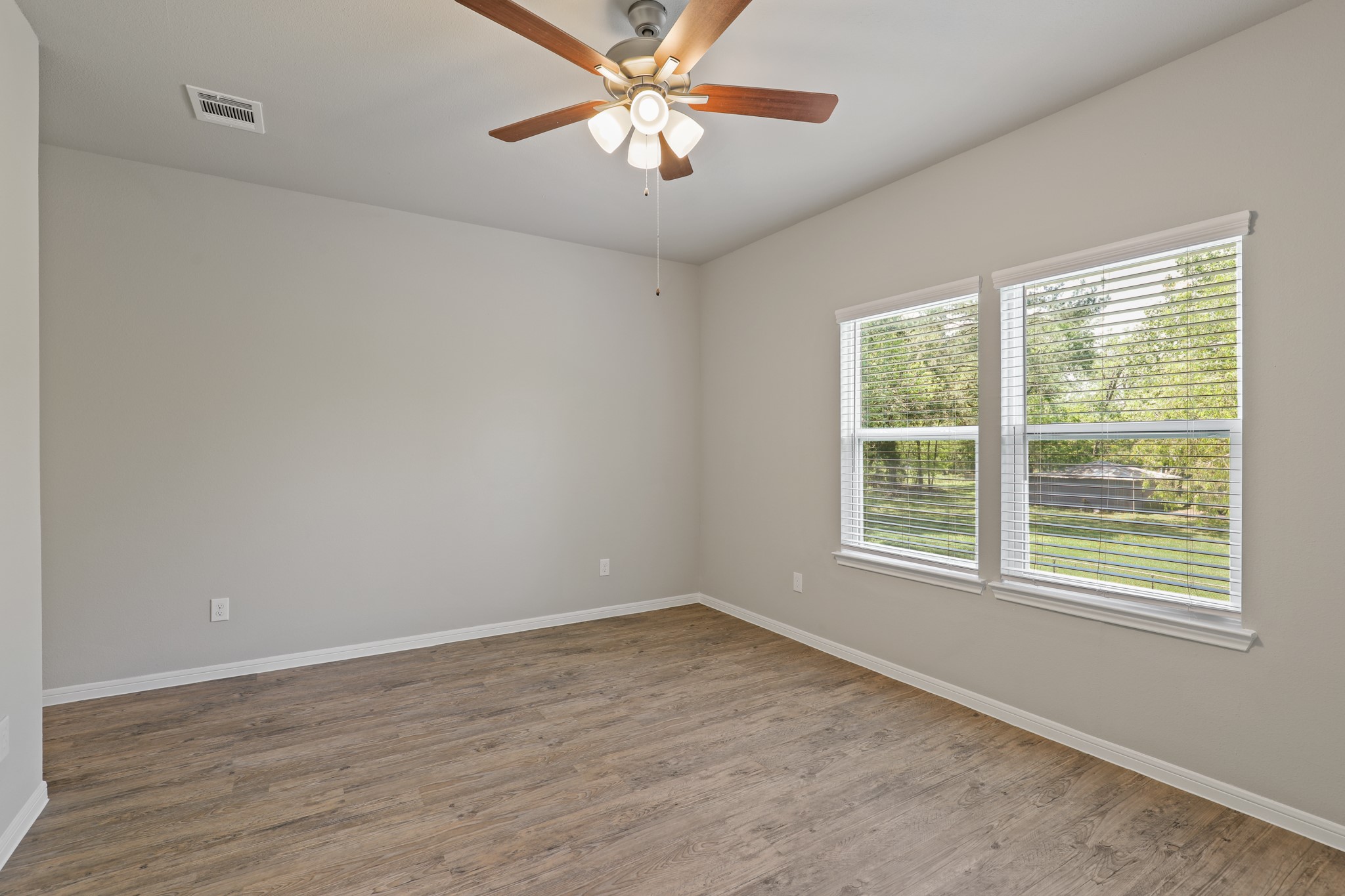 13514 Axel Lane Houston, TX 77047 - Photo 21 of 34 an empty room with a window and a fan