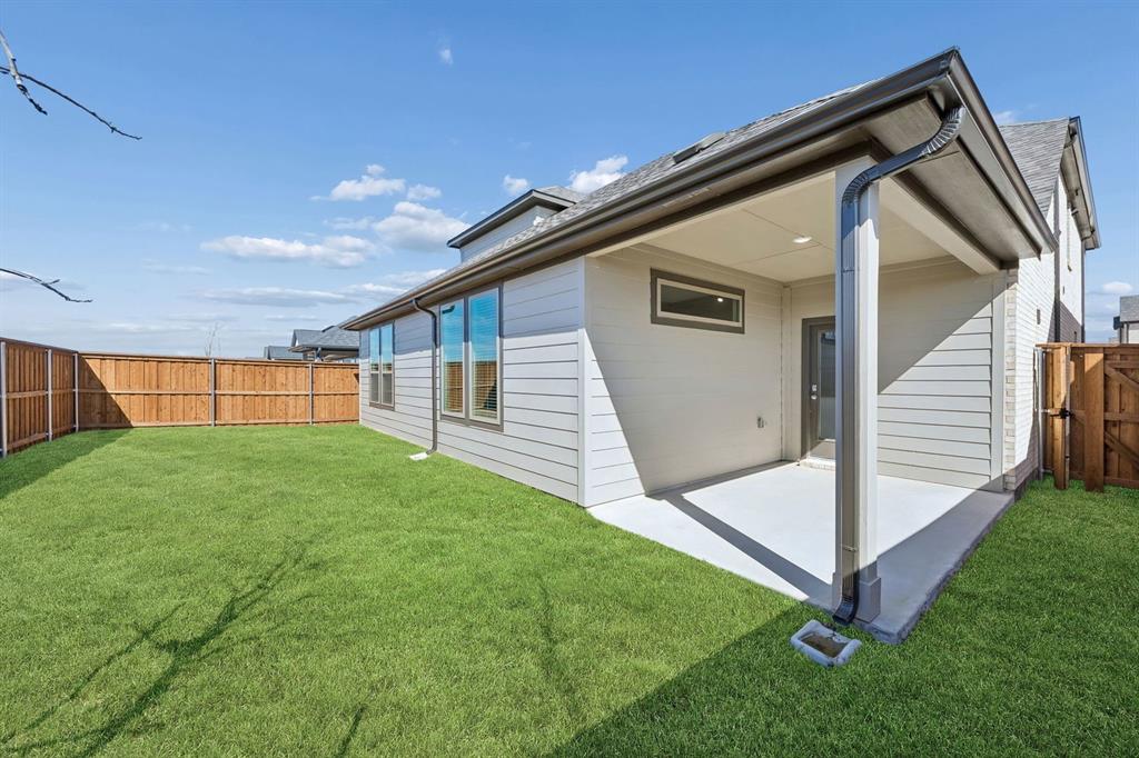 1477 Companero Street Haslet, TX 76052 - Photo 31 of 35 Covered Patio in the Wimbledon home plan by Trophy Signature Homes – REPRESENTATIVE PHOTO
