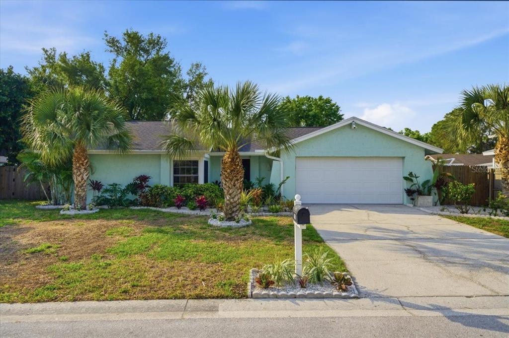 4510 Whitworth Lane Tampa, FL 33624 - Photo 1 of 1 a front view of house with yard and trees