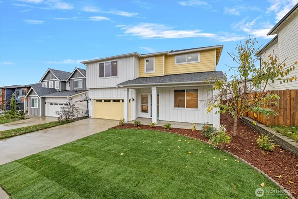 front view of a house with a yard
