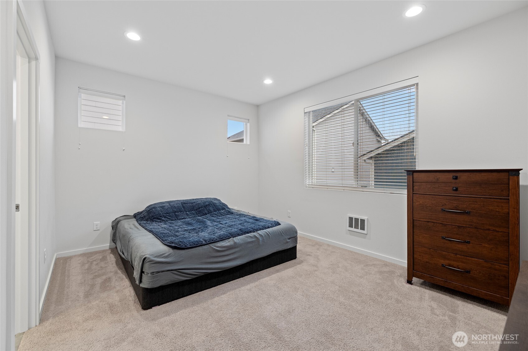 2113 Lancaster Way Ferndale, WA 98248 - Photo 17 of 32 a living room with furniture and a dresser