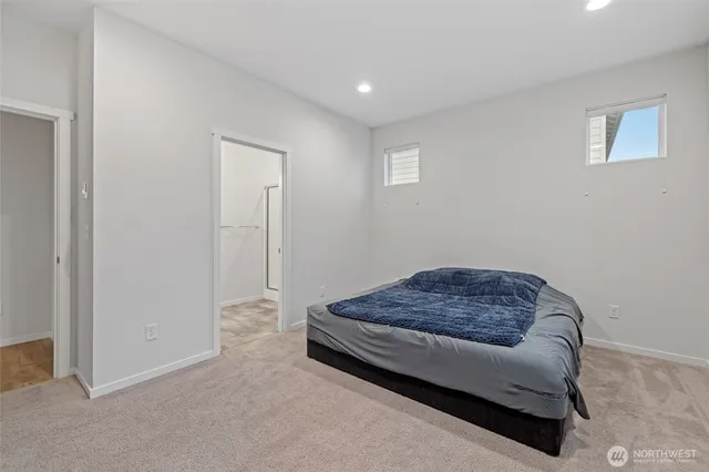 a room with a bed and a cabinet