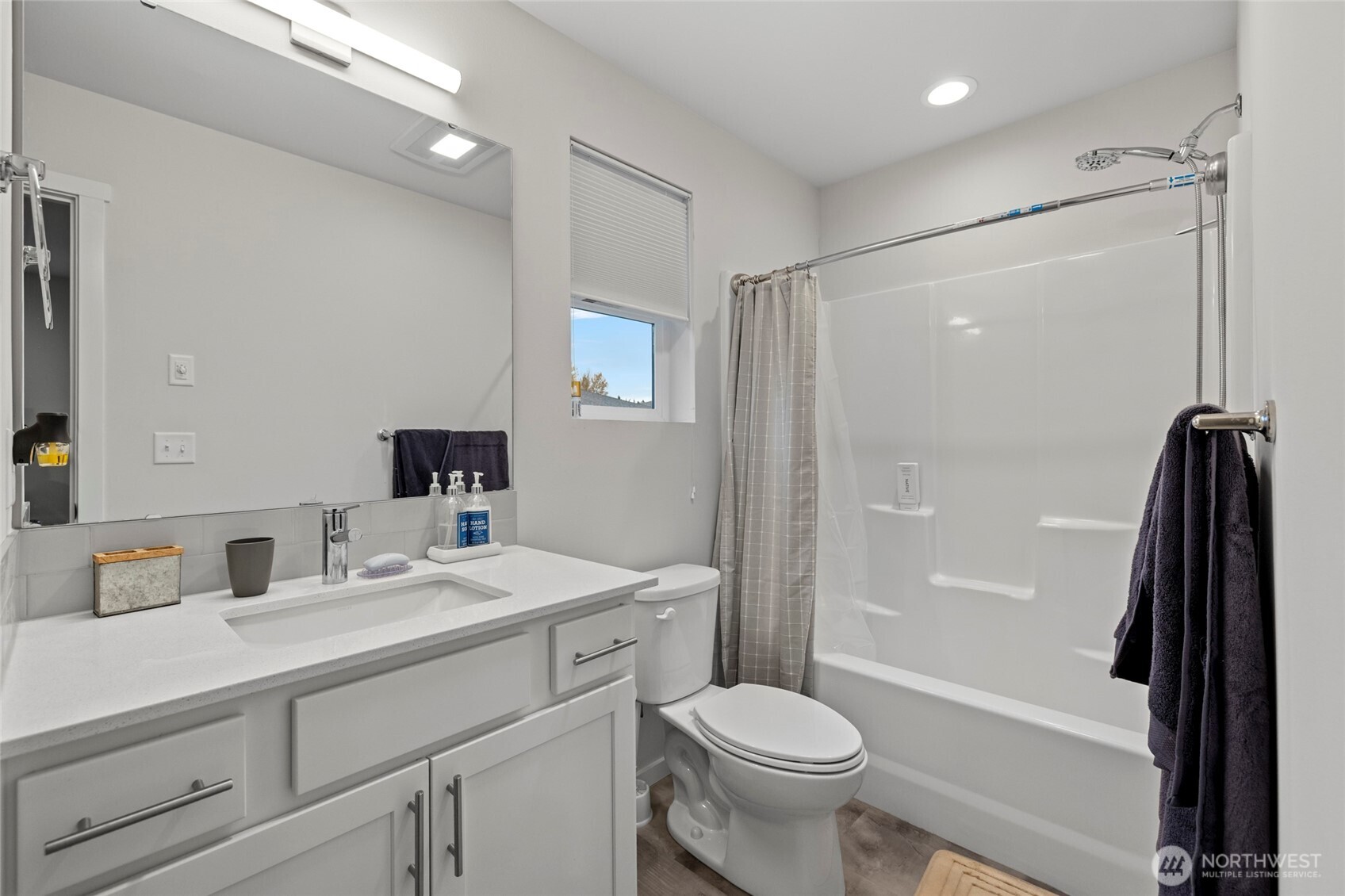 2113 Lancaster Way Ferndale, WA 98248 - Photo 26 of 32 a bathroom with a sink a toilet and shower