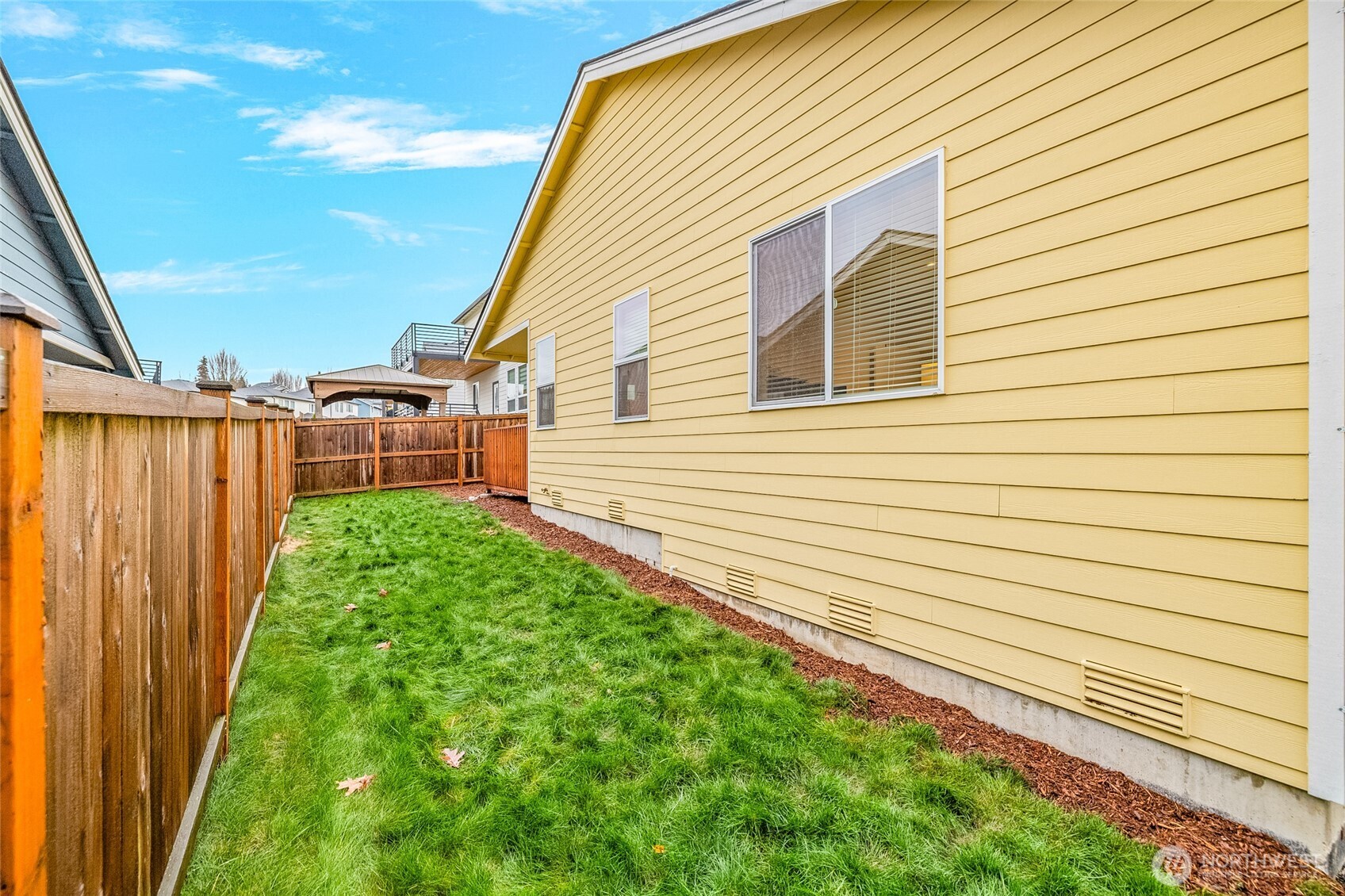 2113 Lancaster Way Ferndale, WA 98248 - Photo 30 of 32 a view of a backyard with a garden