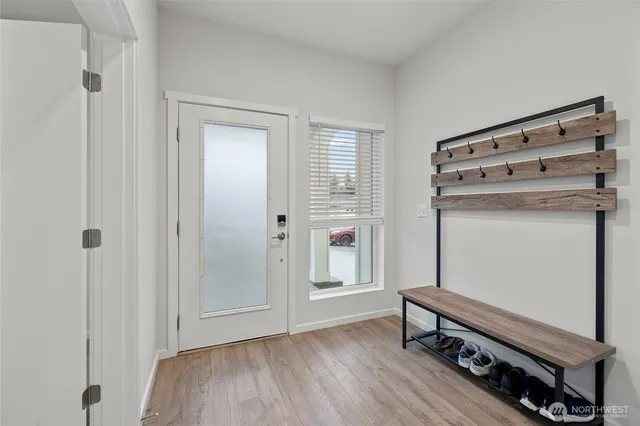 a room with a wooden floor and a window