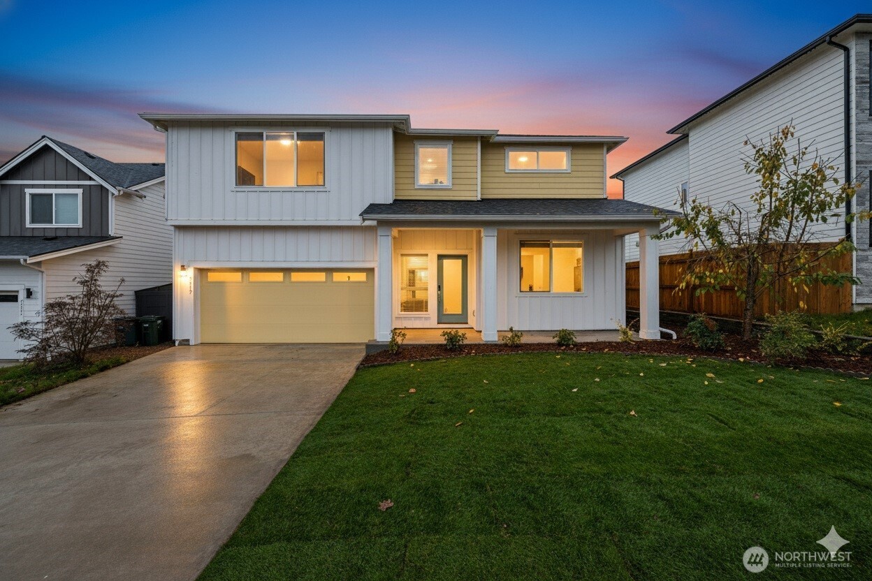 2113 Lancaster Way Ferndale, WA 98248 - Photo 32 of 32 a front view of a house with a yard