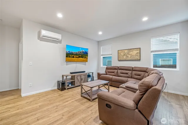 a living room with furniture and a window