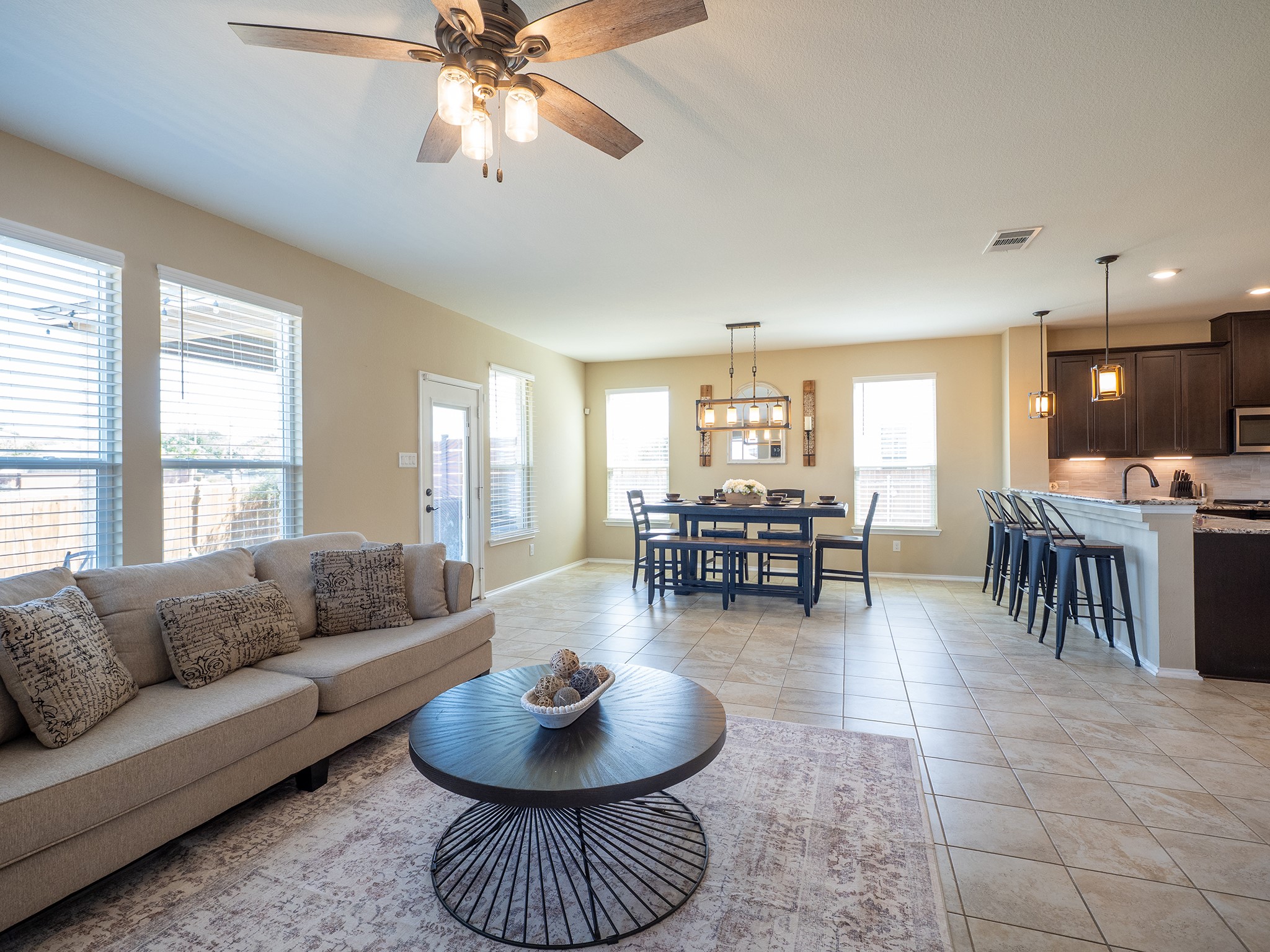 104 Rocroi Drive Georgetown, TX 78626 - Photo 4 of 40 Ceramic tile floors anchor this spacious, open-concept living area and adjacent dining zone.
