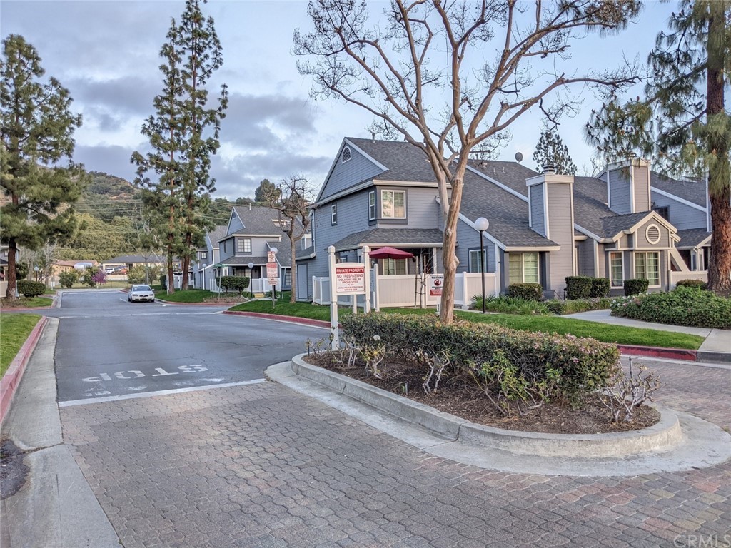 1641 Dimas Court Azusa, CA 91702 - Photo 3 of 14 a view of a street with houses on both side