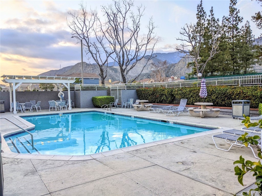 1641 Dimas Court Azusa, CA 91702 - Photo 9 of 14 a view of swimming pool with outdoor seating and city view